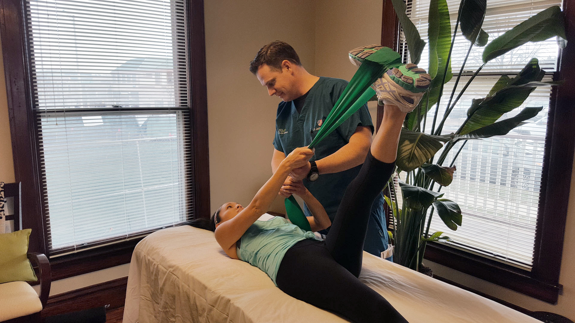 Dr. Justin Hunter performing hands-on rehabilitative and soft tissue work in Naperville