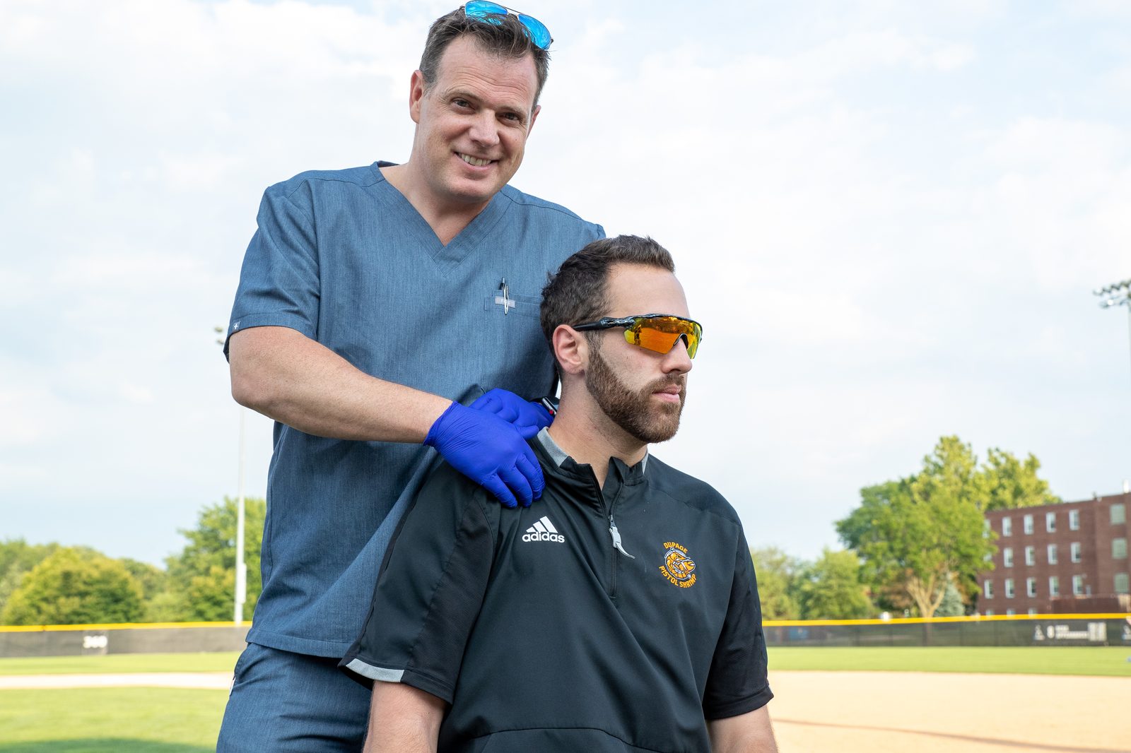 Dr. Justin Hunter treating a young athlete on the sideline